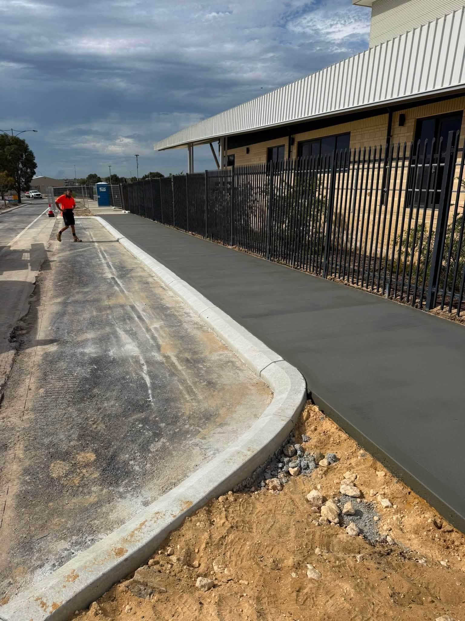 New concrete kerb and footpath poured on a commercial site