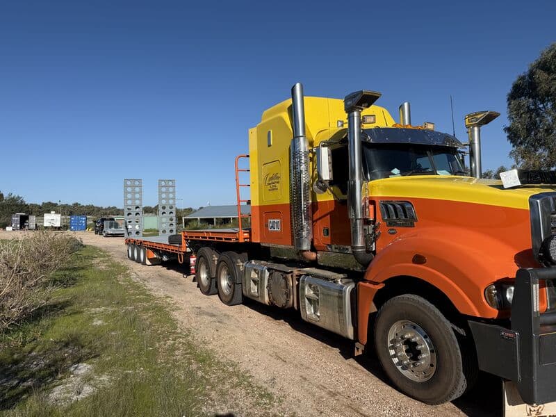 Cadillac Contracting prime mover and float trailer loaded with steel forms